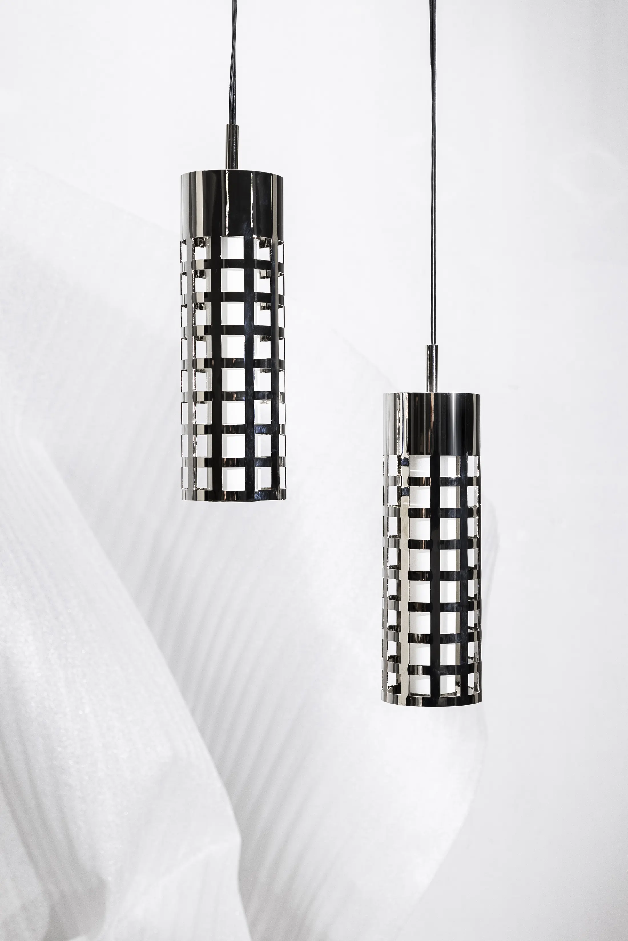 Airy and sophisticated, the Standing Steel Pendant Lamp by SOFIADEFRANCESCO blends modern industrial design with soft lighting, creating a serene ambiance.